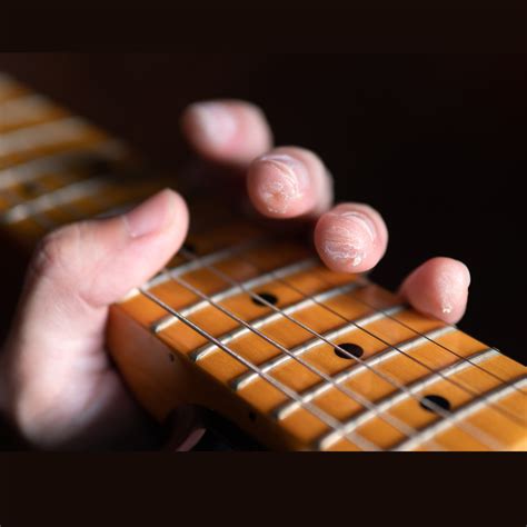 How do guitarists deal with calluses?