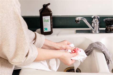 How do hospitals clean blood stains?