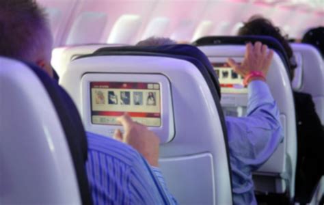 How do people watch movies on a plane?