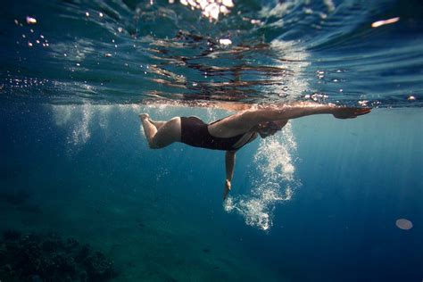 How do swimmers see underwater?