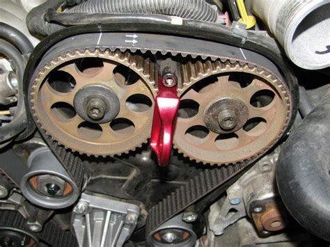 How do you adjust a timing belt?