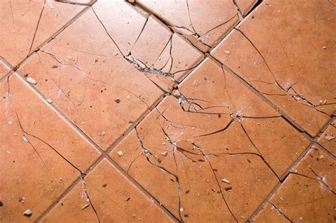 How do you break porcelain tile?