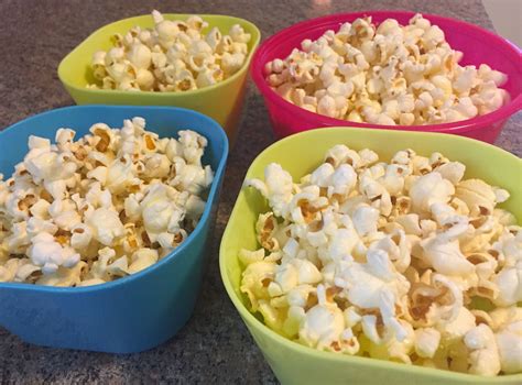 How do you butter popcorn without making it soggy?