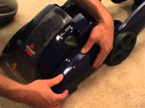 How do you change the belt on a Bissell Proheat carpet cleaner?