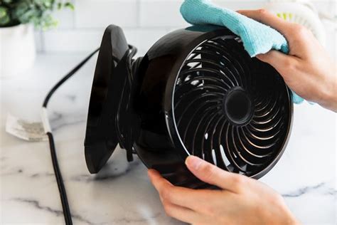 How do you clean a fan?