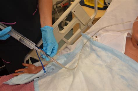 How do you clean a nasogastric tube?