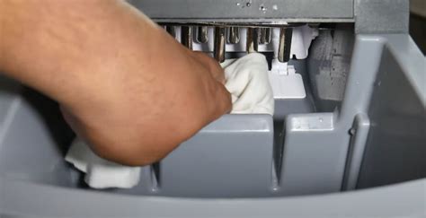 How do you clean a portable ice maker?
