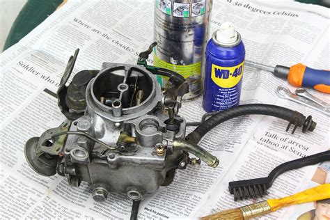 How do you clean a small carburetor?