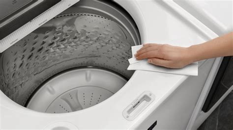 How do you clean a washing machine detergent dispenser?