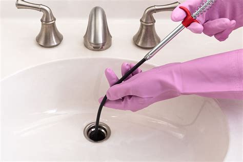 How do you clear a slow draining sink?