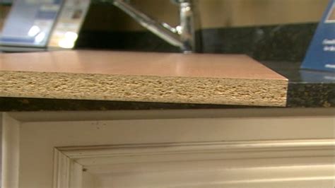 How do you cover particle board cabinets?