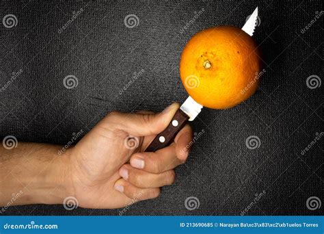 How do you cut an orange with a knife?