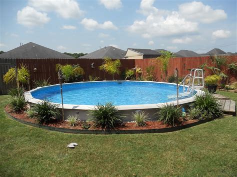 How do you cut grass around an above ground pool?