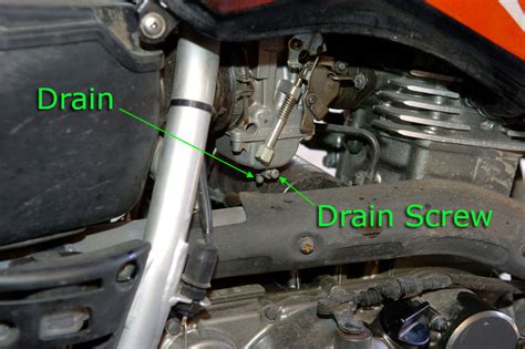 How do you drain water from a carburetor?