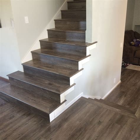 How do you finish laminate flooring at the top of stairs?