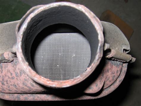 How do you fix a clogged catalytic converter without replacing it?