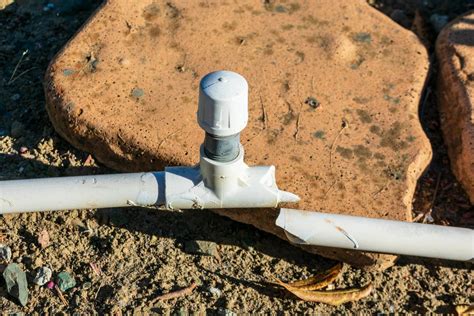 How do you fix a hole in a PVC irrigation pipe?