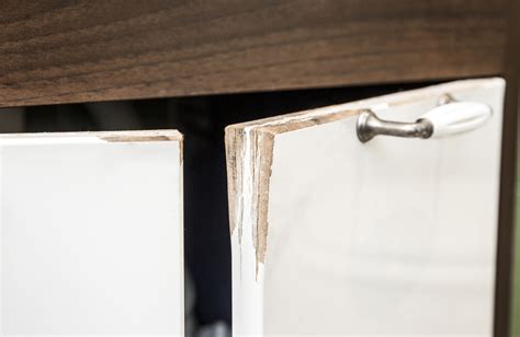 How do you fix peeling particle board cabinets?