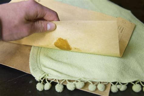 How do you get candle wax out of a blanket?