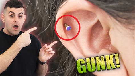 How do you get gunk out of earring holes?