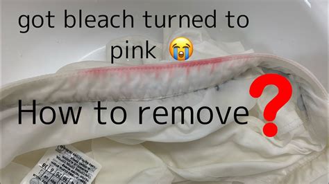 How do you get pink bleach out of white clothes?