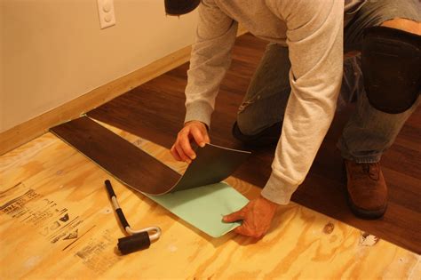 How do you get vinyl flooring to stick to plywood?