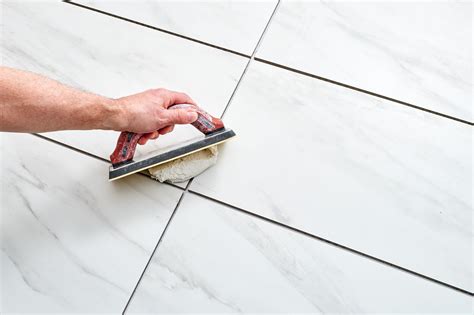 How do you grind tile grout?