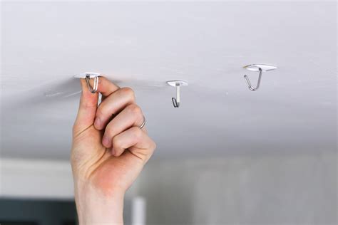 How do you hang something from the ceiling without a hook?