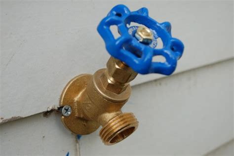 How do you install a water spigot outside?