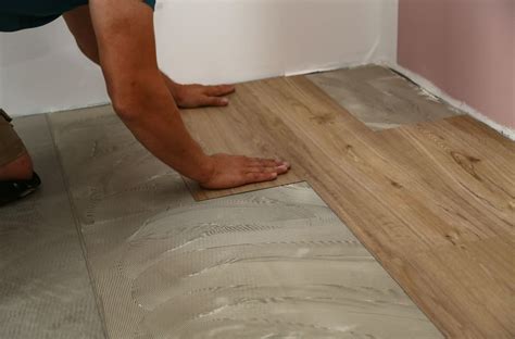How do you install vinyl flooring on rough concrete?