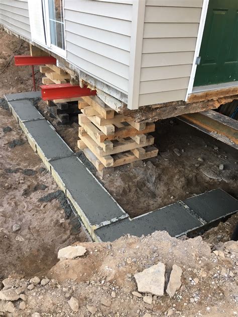 How do you jack up a house foundation?