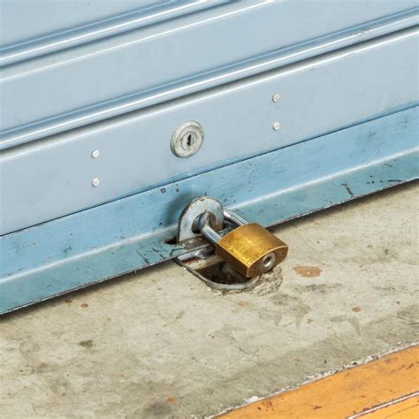 How do you lock an up and over garage door?