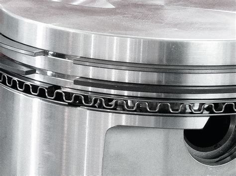 How do you lubricate piston rings?