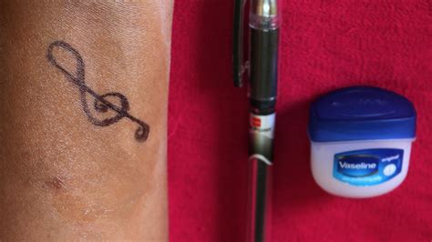 How do you make a fake tattoo with a pen?