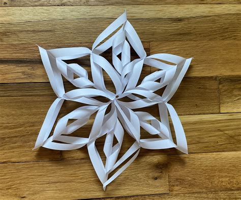 How do you make a paper snowflake doily?