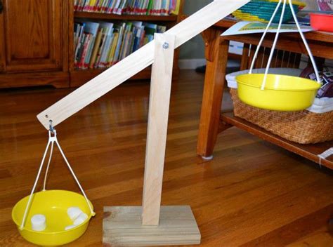 How do you make a weighing balance for kids?