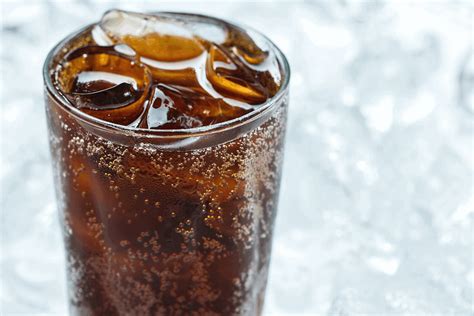 How do you make soda flat without shaking it?