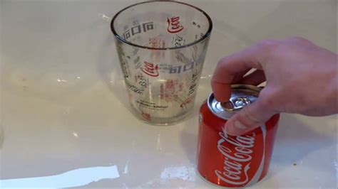 How do you open a Coke can without it exploding?