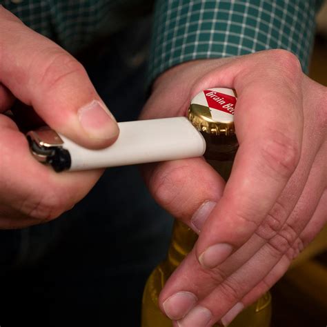 How do you open a bottle with a round lighter?