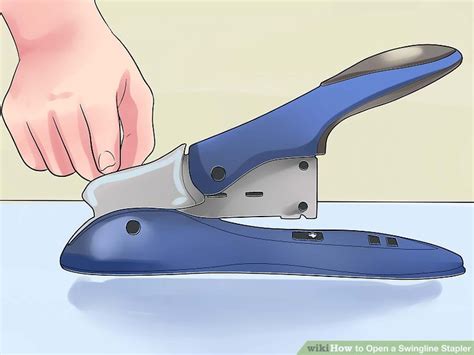 How do you open a heavy duty stapler?