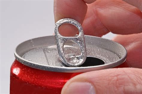 How do you open a soda can that won't open?