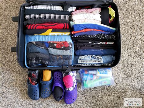 How do you pack an upright suitcase?
