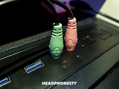 How do you plug headphones into PS4?