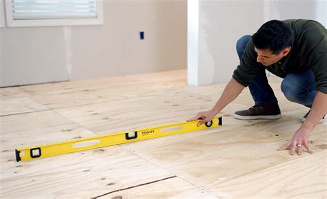 How do you prepare a subfloor for hardwood flooring?