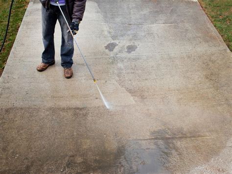 How do you pretreat a driveway for pressure washing?
