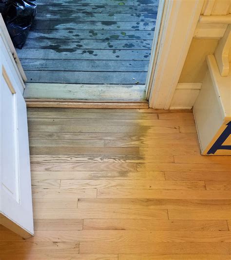 How do you prevent water damage on hardwood floors?