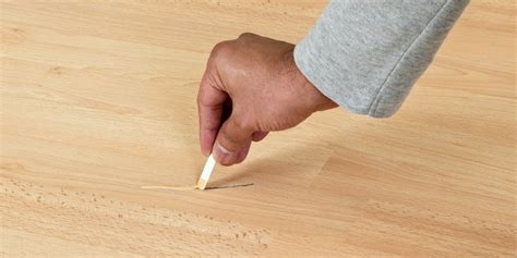 How do you protect laminate flooring from scratches?