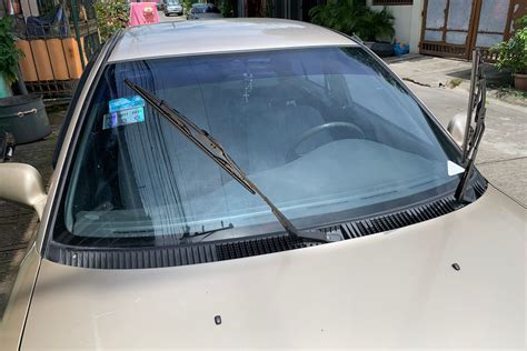 How do you raise car wipers?