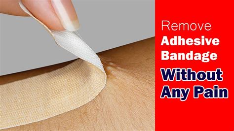 How do you remove adhesive bandage without pain?