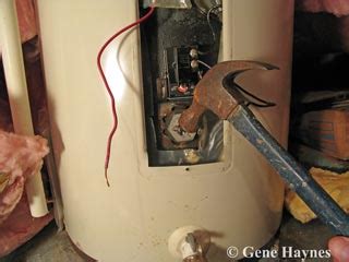 How do you remove an old water heater element?